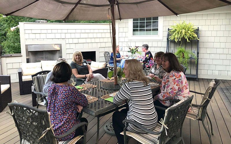 Ladies gathered around a patio table