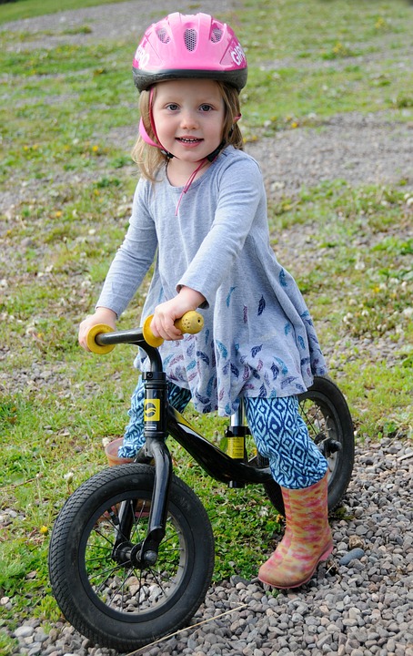 Young girl with bike helmet
