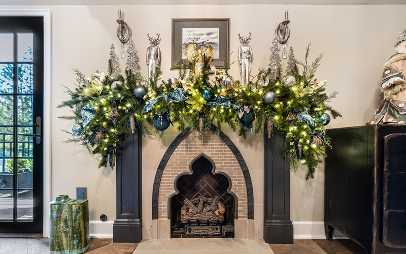 A festively decorated fireplace that was featured on the 2023 Sugar Plum Tour of Holiday Homes.