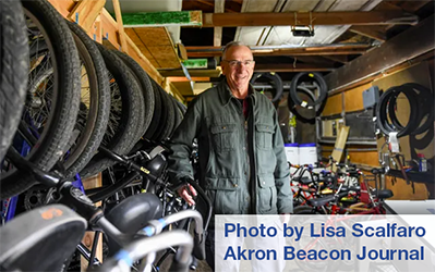 Scott Stuetzer, president of Cycling Schools, shows off the program's nearly 100 bikes.